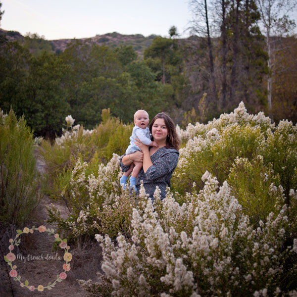 Mathilde with her child among wildflowers